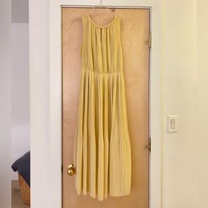 Yellow pleated A line skirt